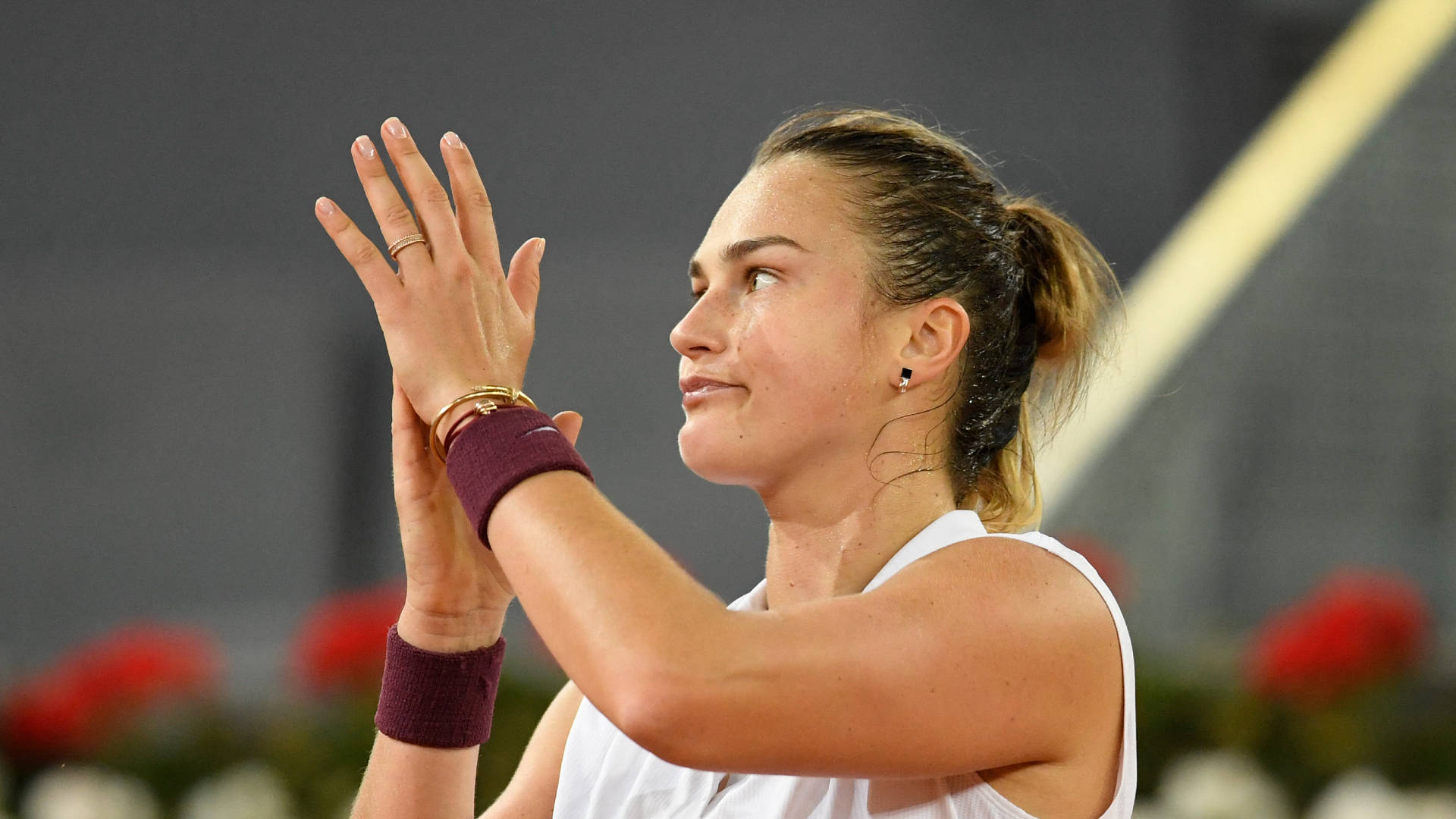 Aryna Sabalenka Appreciating Her Opponent With Applause. Background