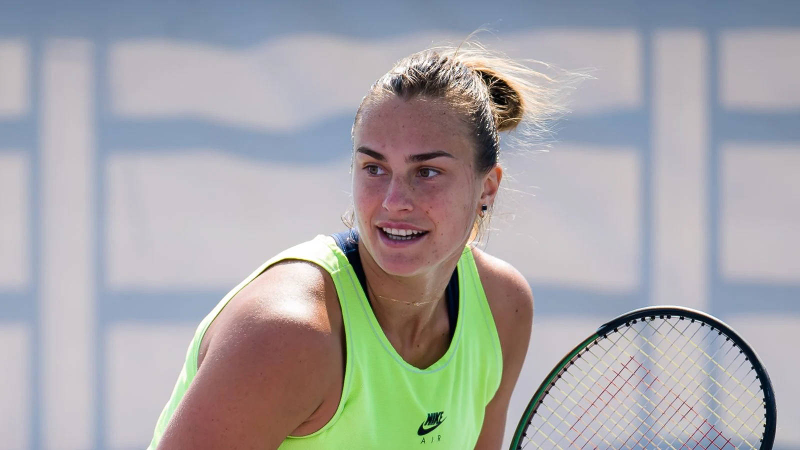 Aryna Sabalenka Dazzles In Bright Yellow Sportswear Background