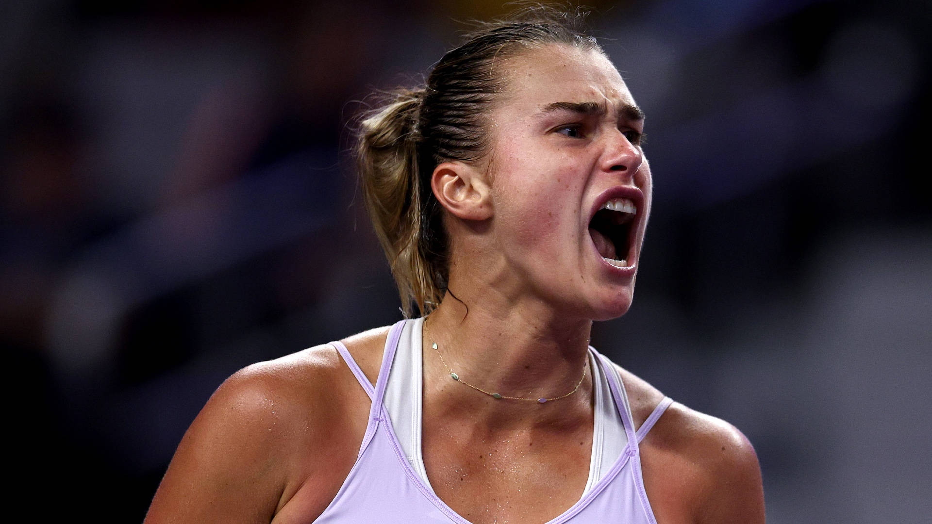 Aryna Sabalenka Expressing Intensity In The Tennis Court Background