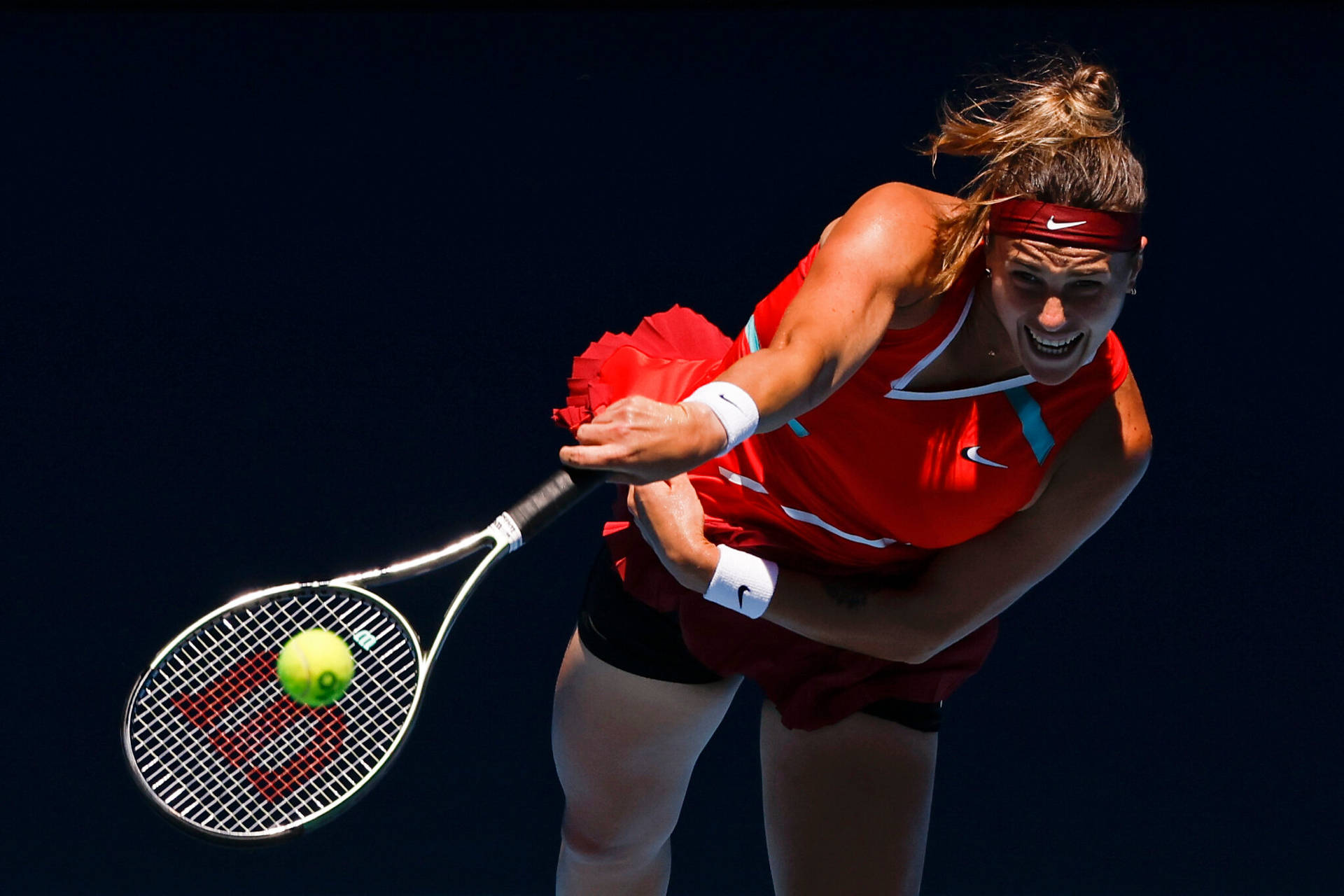 Aryna Sabalenka Hitting The Tennis Ball Background