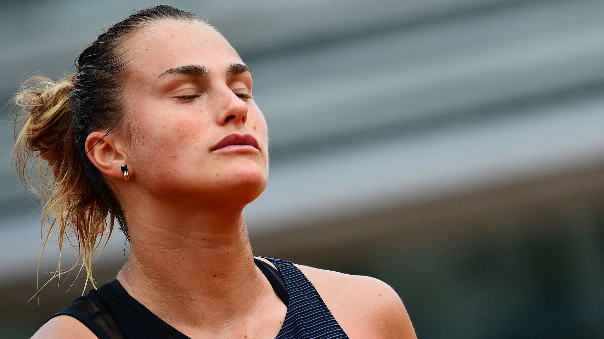 Aryna Sabalenka In Her Zen Moment On Court Background