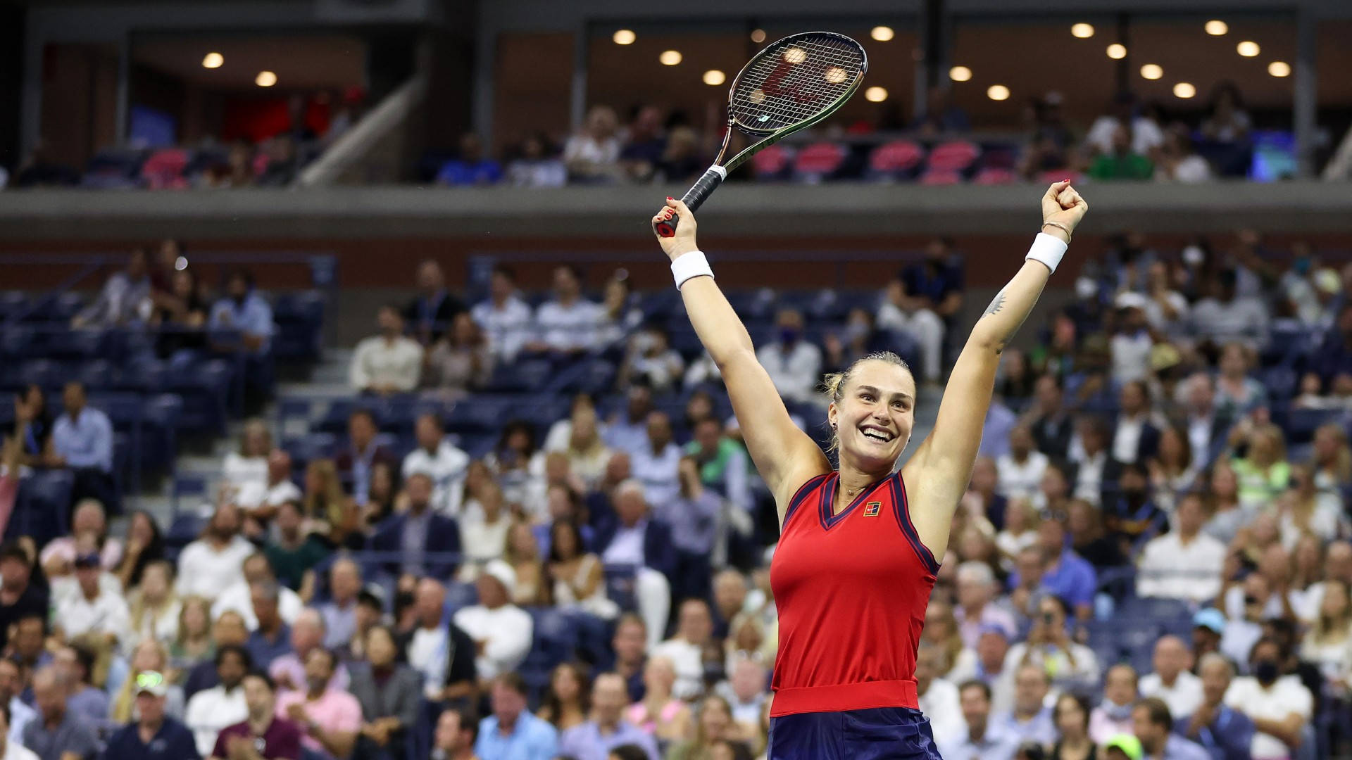 Aryna Sabalenka Raising Her Arms Triumphantly Background