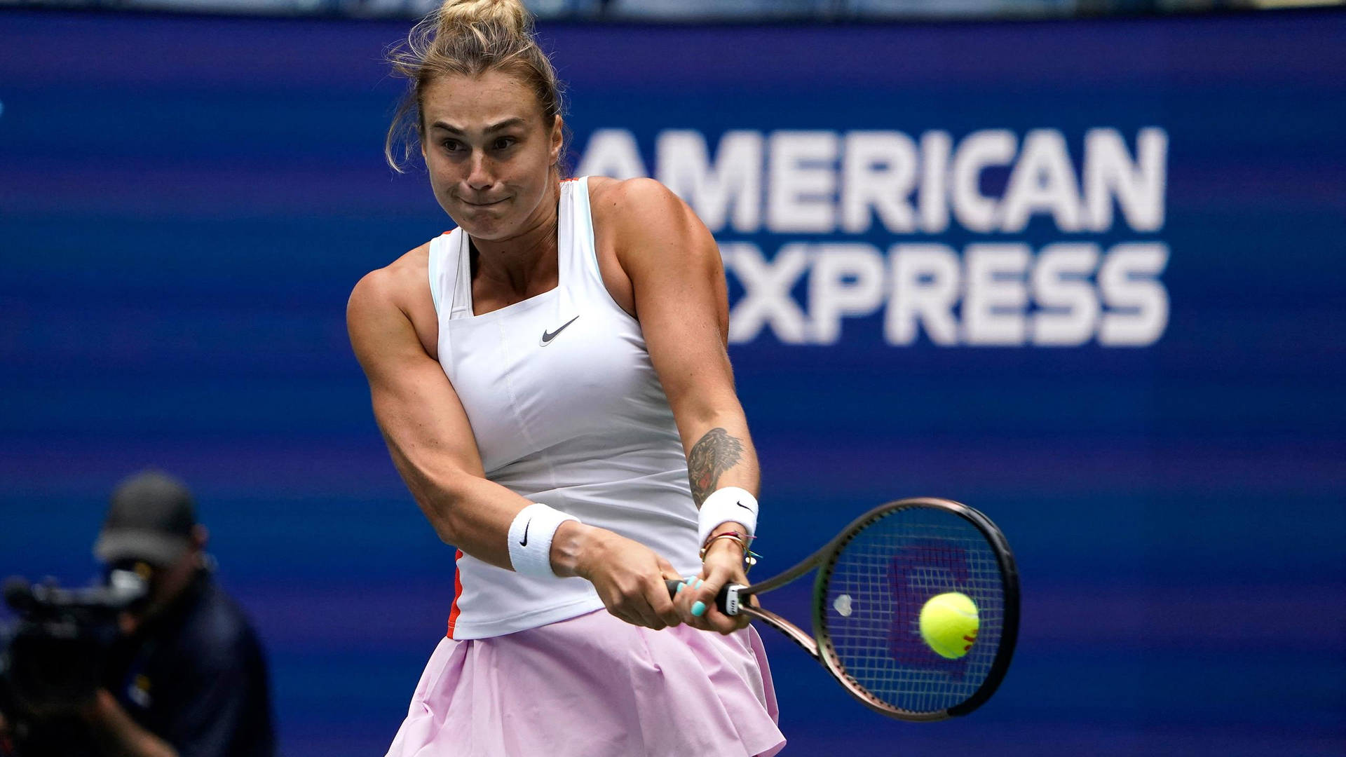 Aryna Sabalenka Using Both Hands Background