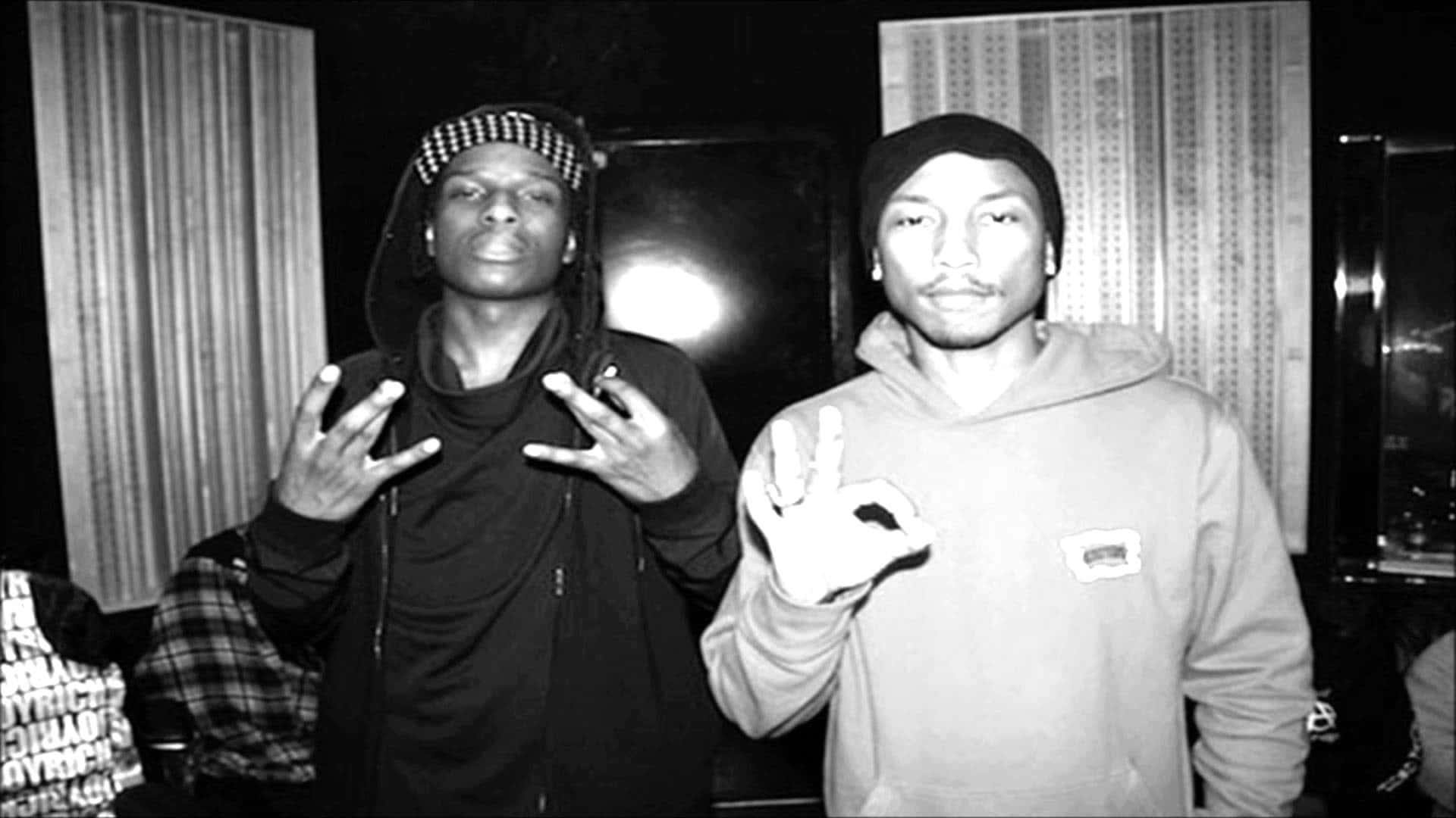 Asap Rocky And Tyler The Creator Captured In A Moment Of Comradery Background