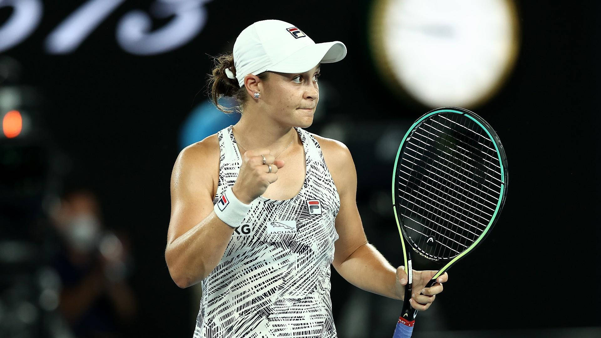 Ashleigh Barty Holding Her Black And Green Racket Background