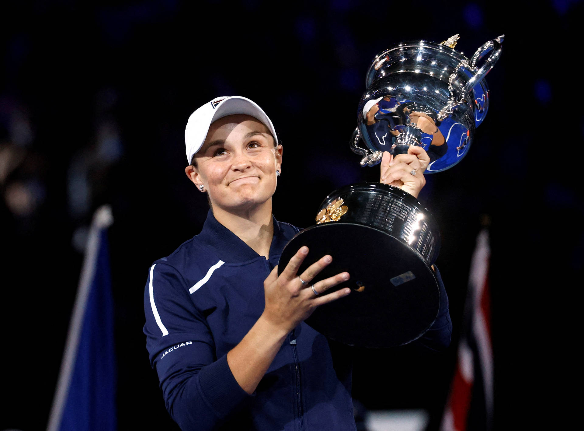 Ashleigh Barty Jubilantly Holding Her Trophy Background