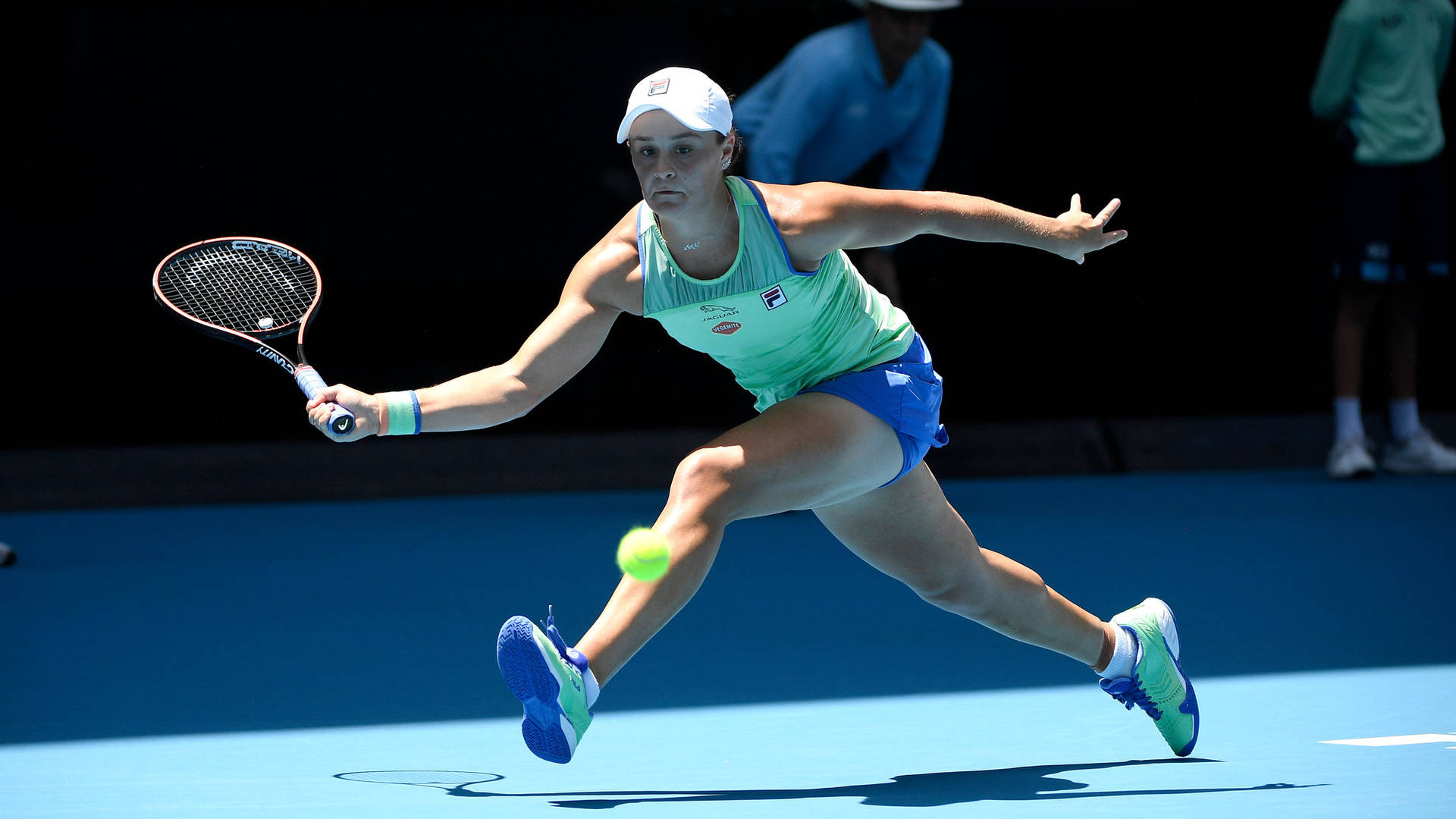 Ashleigh Barty Leaping For The Ball Background