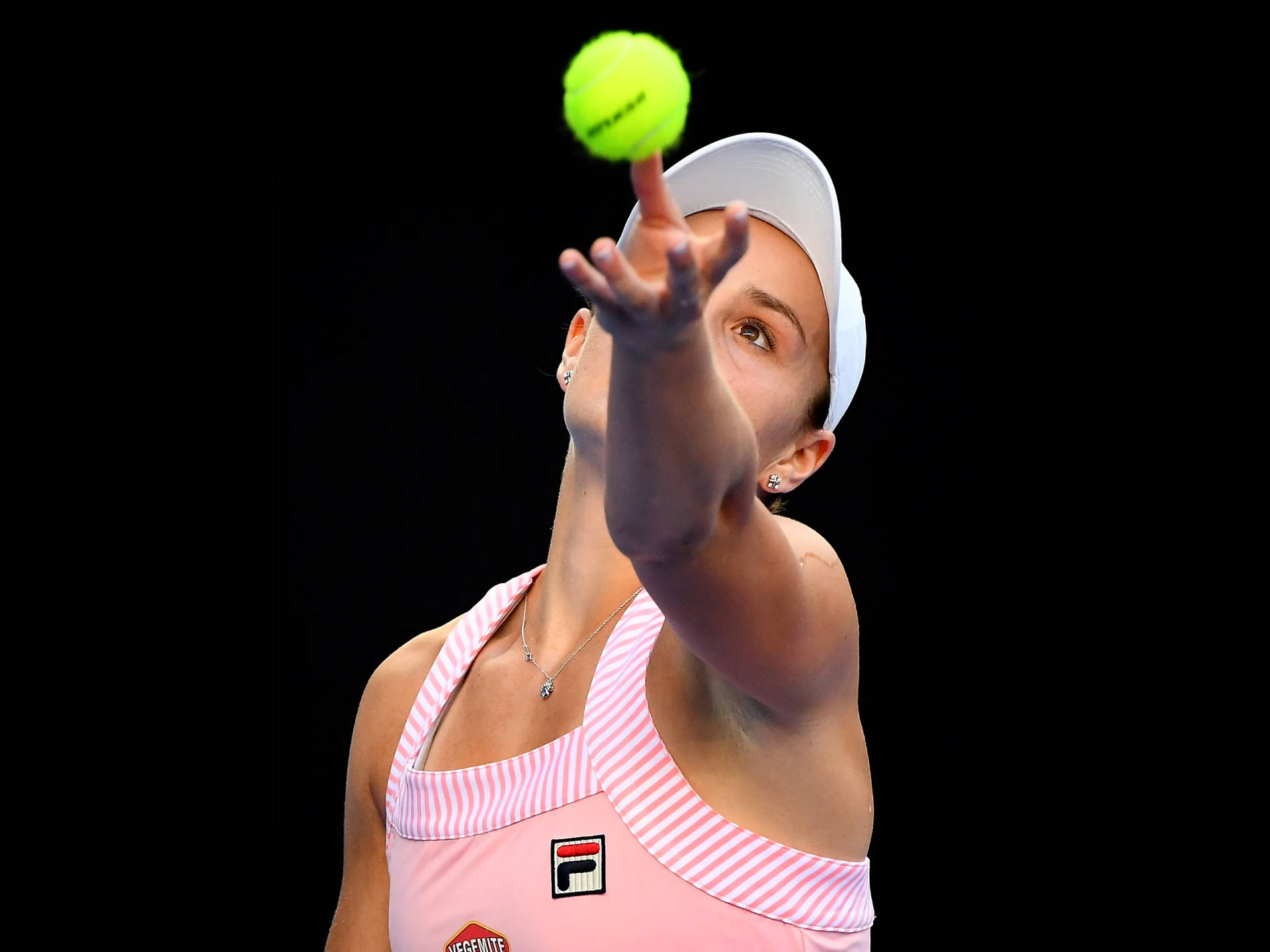 Ashleigh Barty Serving The Ball Background