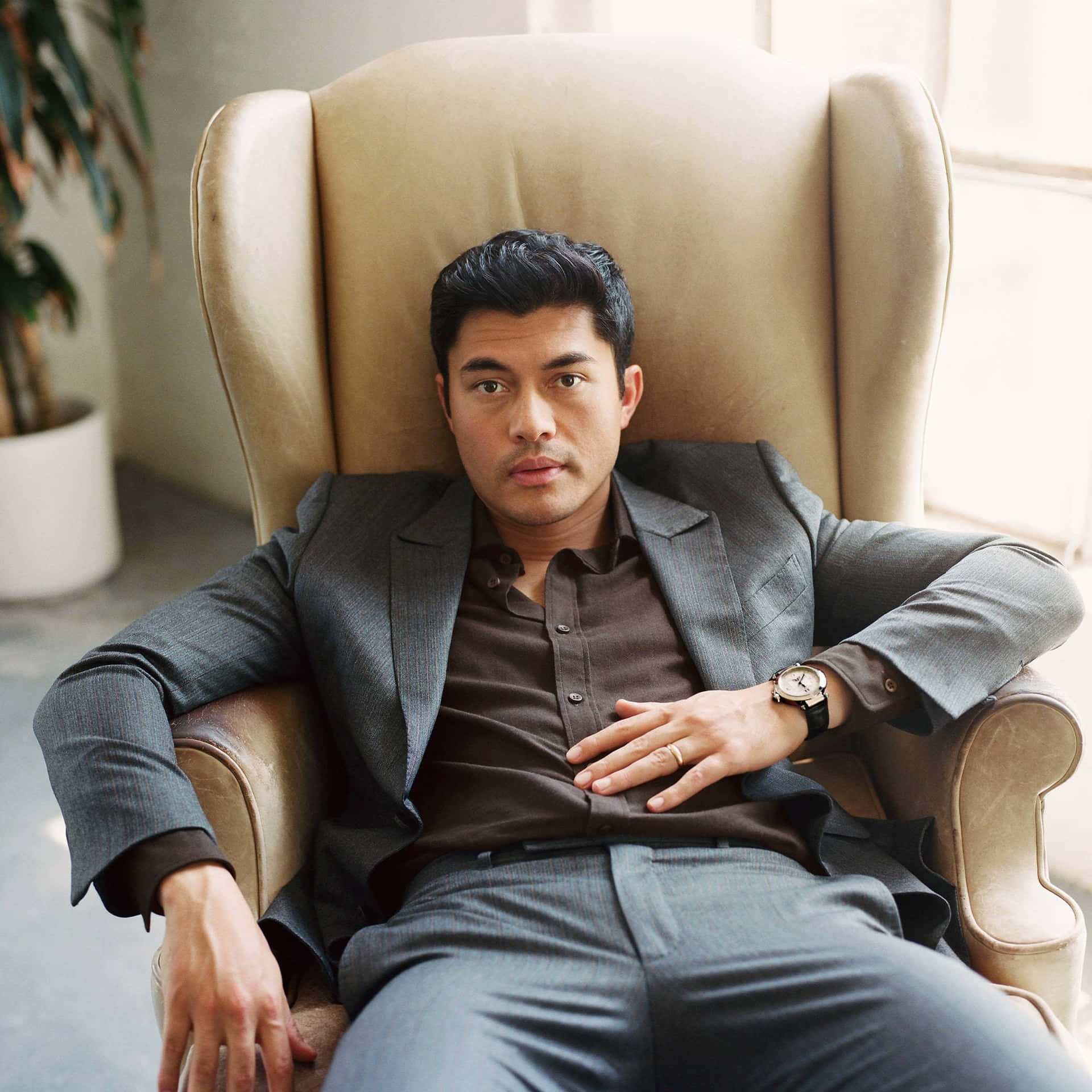Asian Actor On The Chair Background