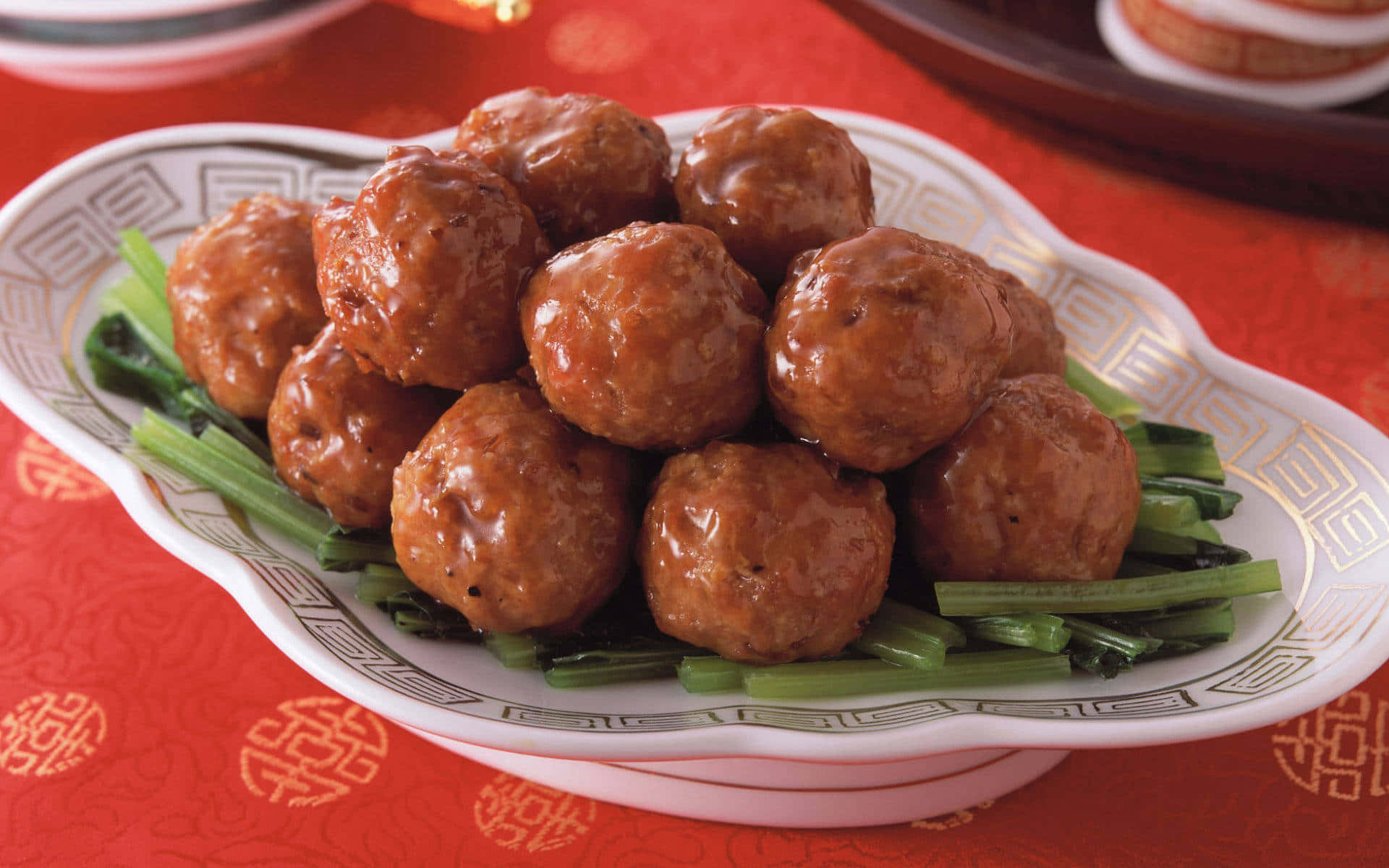 Asian Style Glazed Meatballson Greens Background