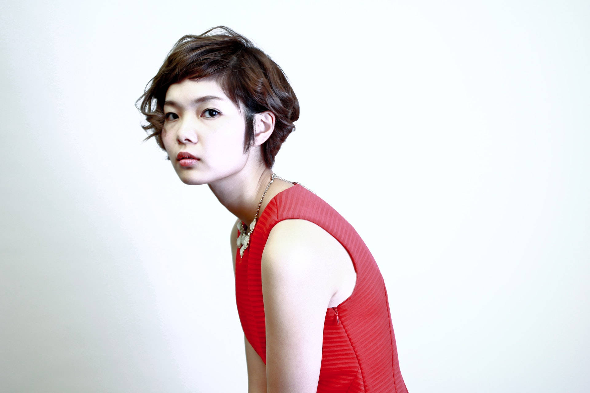 Asian Woman In Red Sleeveless Dress