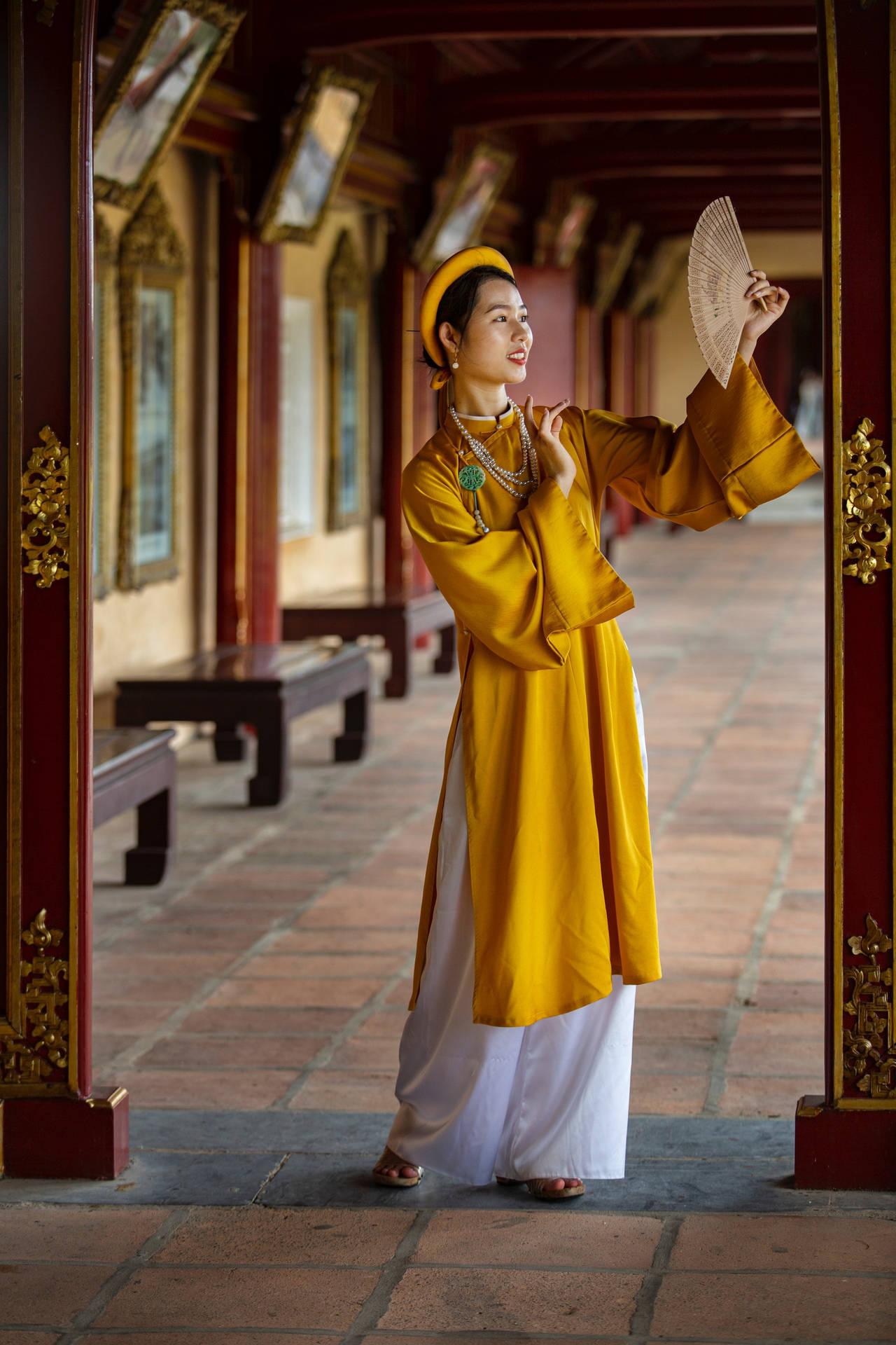 Asian Woman In Traditional Vietnamese Outfit Background
