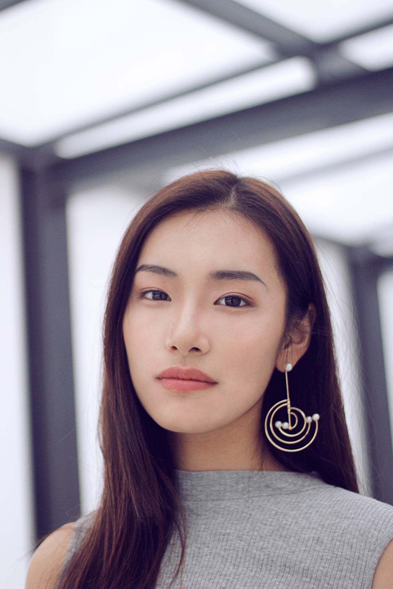Asian Woman Wearing A Dangling Earring