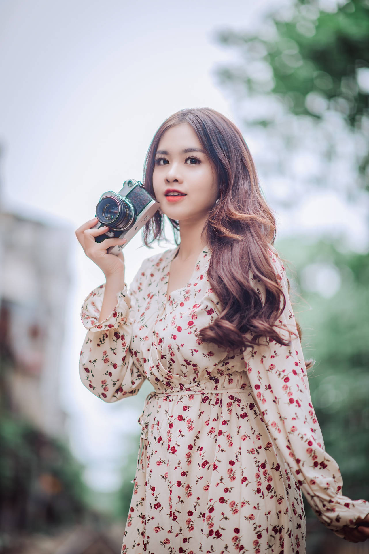 Asian Woman With A Professional Camera Background