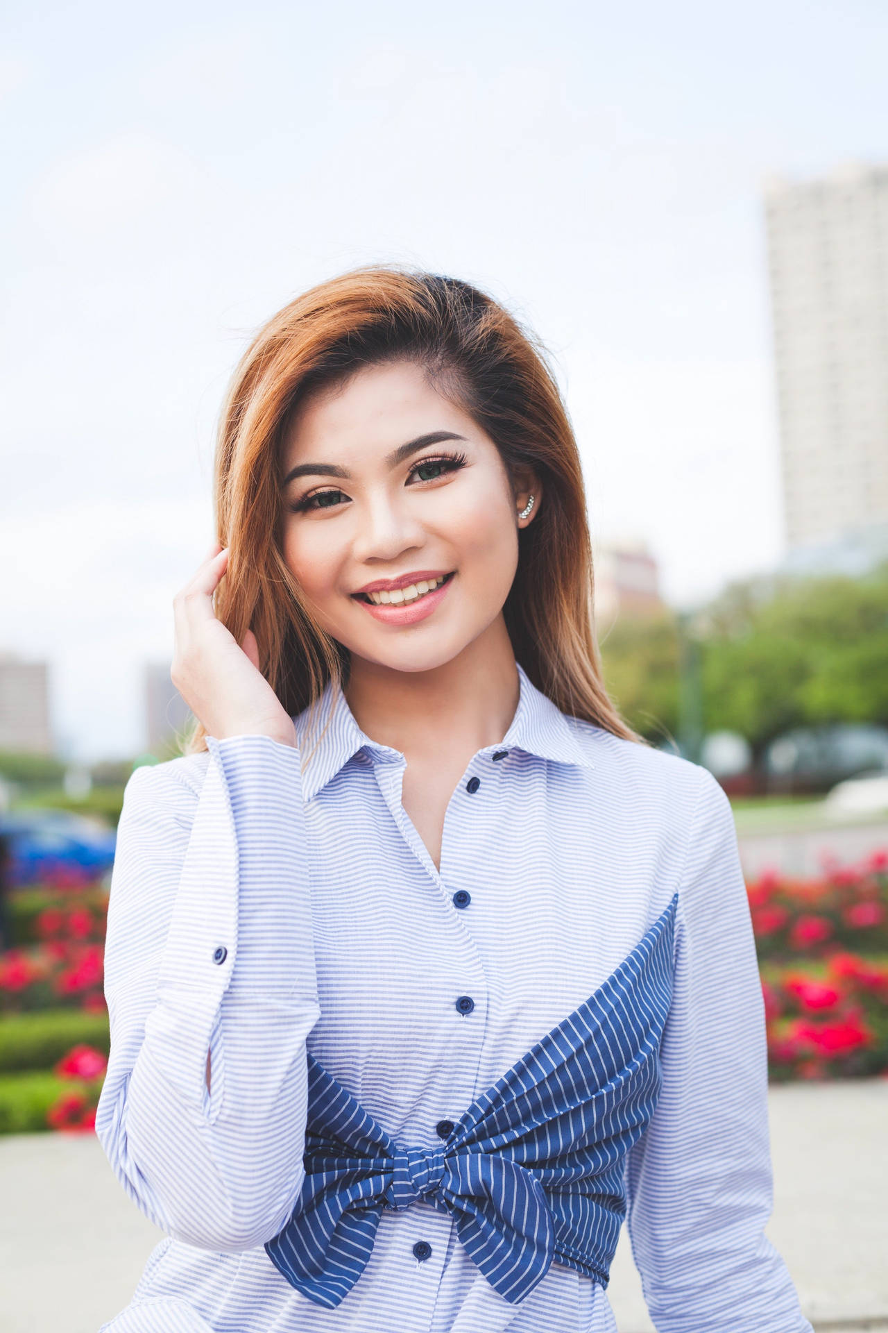 Asian Woman With A Stunning Smile Background