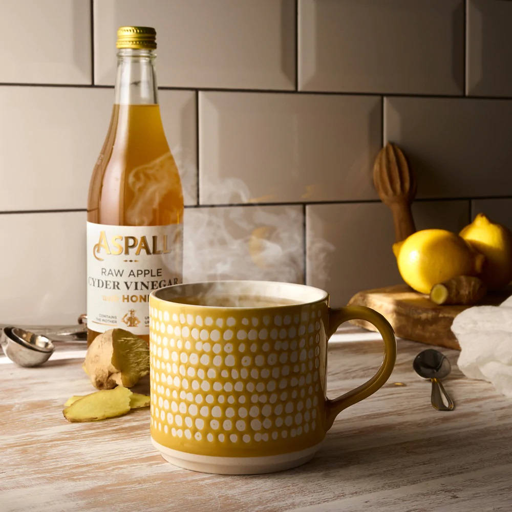 Aspall's Premium Raw Apple Cider Vinegar Background