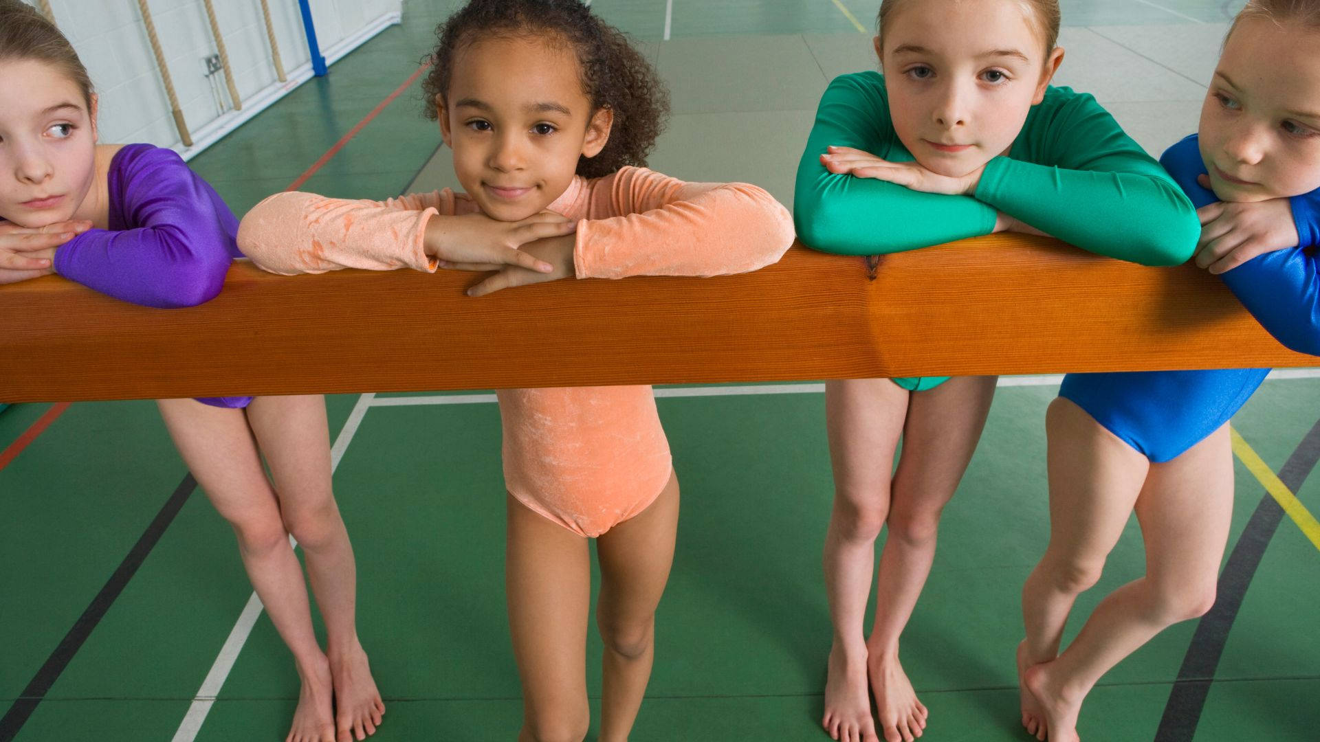 Aspiring Kids Gymnasts Balance Beam Background