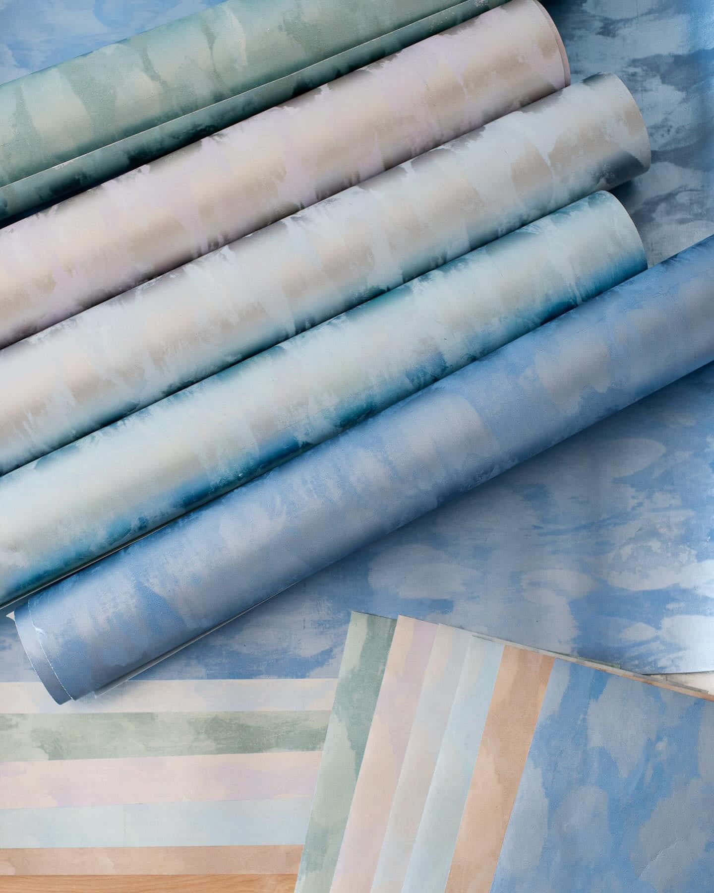 Assorted Calico Fabric Rolls Background