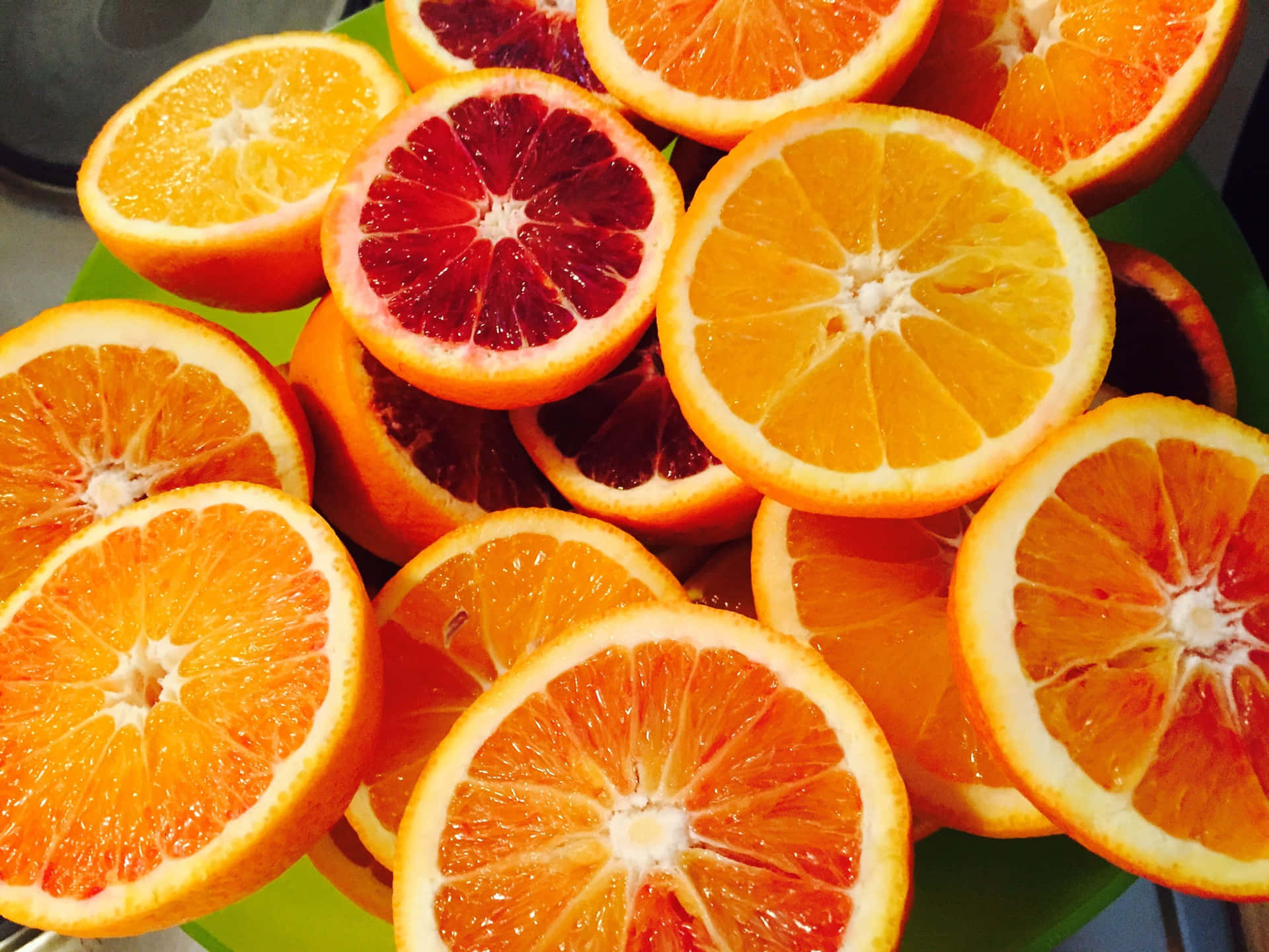 Assorted Citrus Fruits Sliced Background