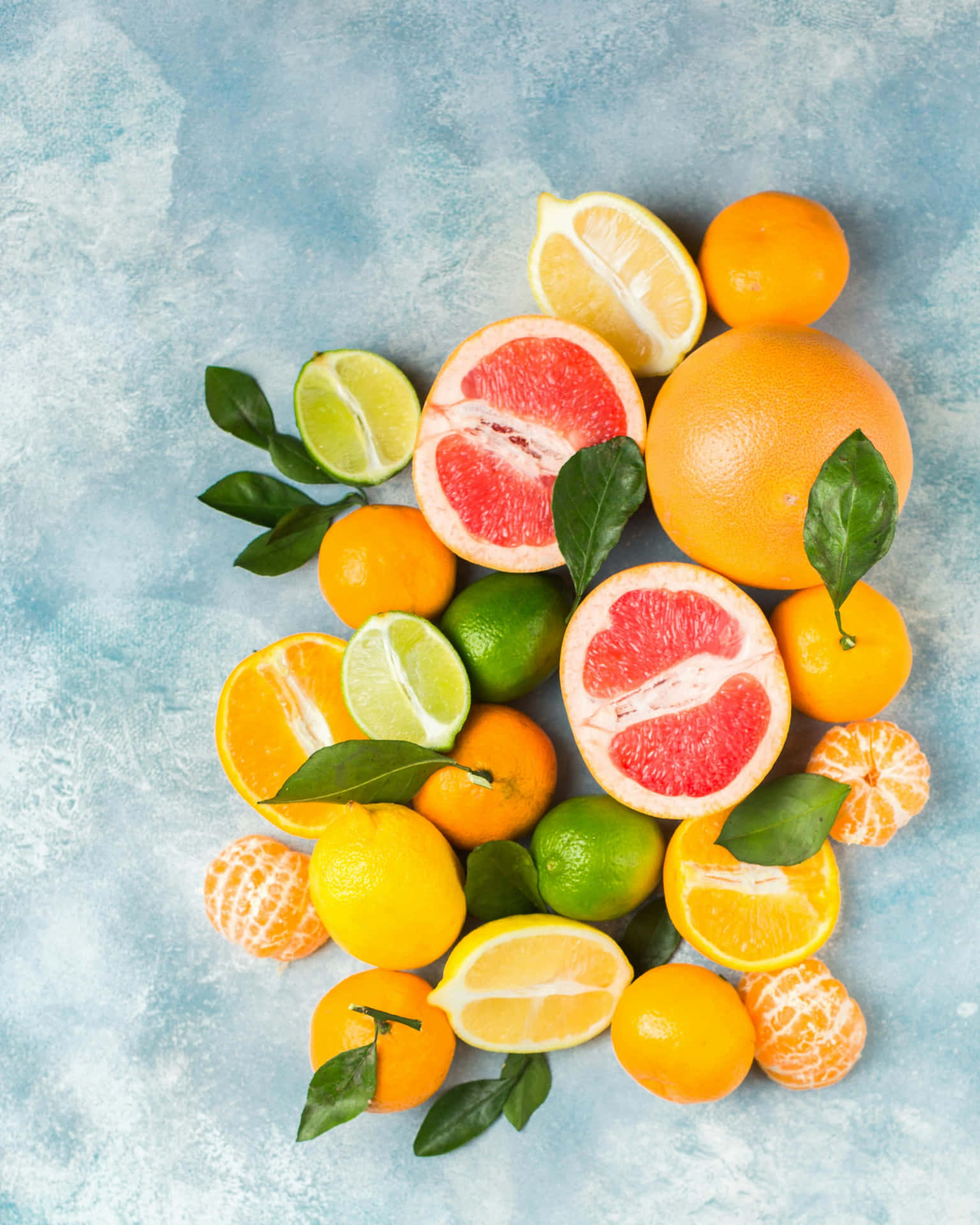 Assorted Citrus Fruits Top View Background