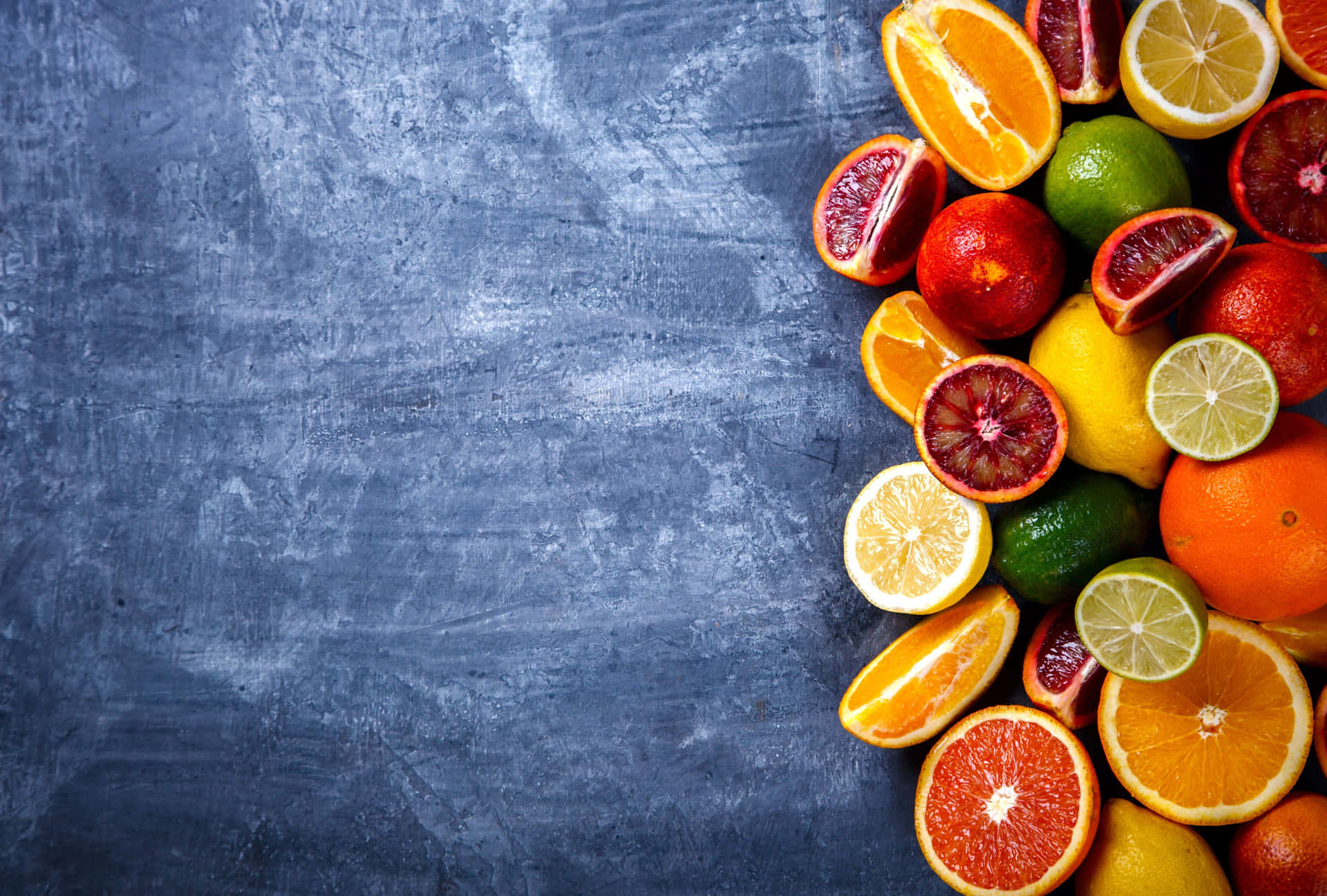 Assorted Citrus Fruitson Blue Background