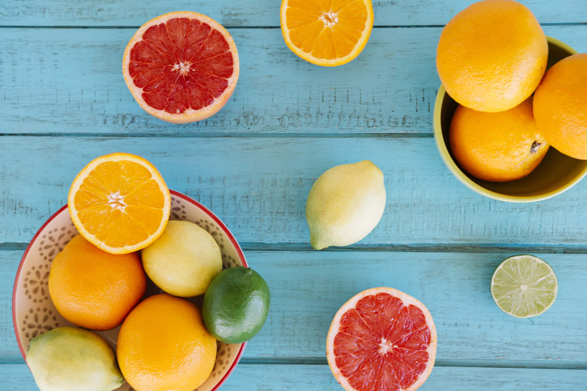 Assorted Citrus Fruitson Blue Wooden Background