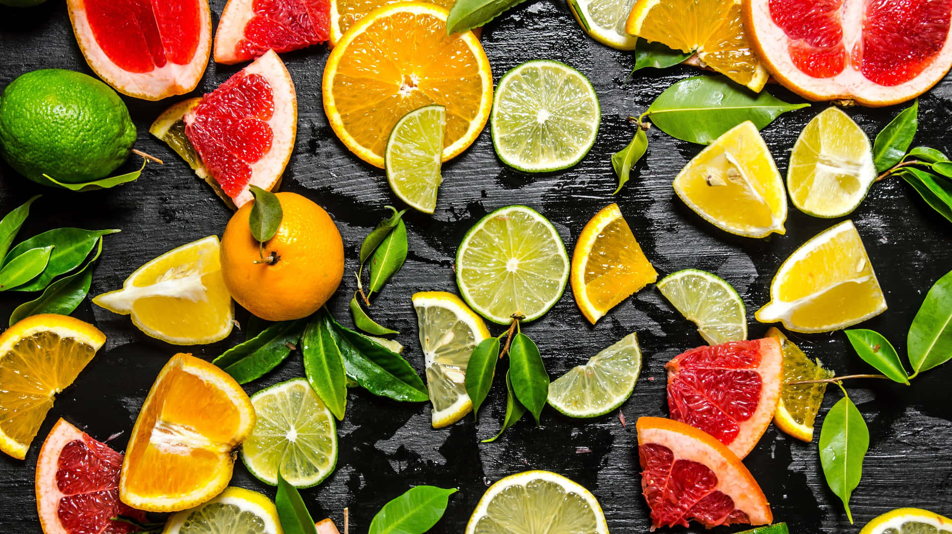 Assorted Citrus Fruitson Dark Background Background