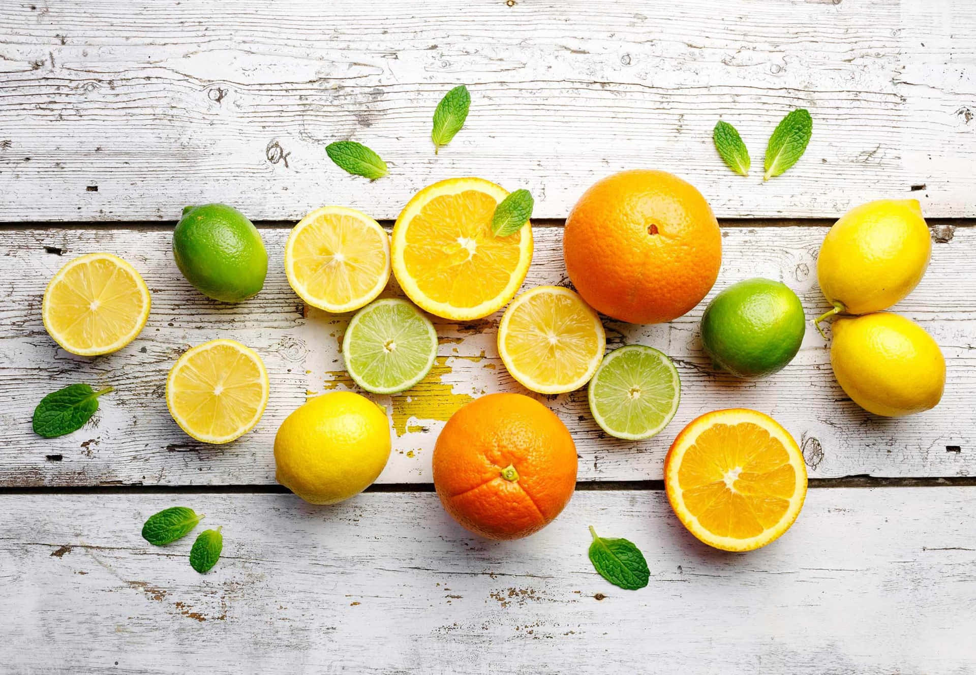 Assorted Citrus Fruitson Wooden Background