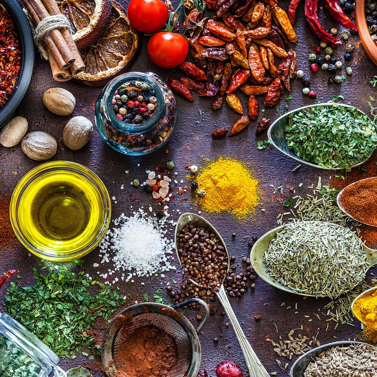 Assorted Herbs And Spices On Table Background