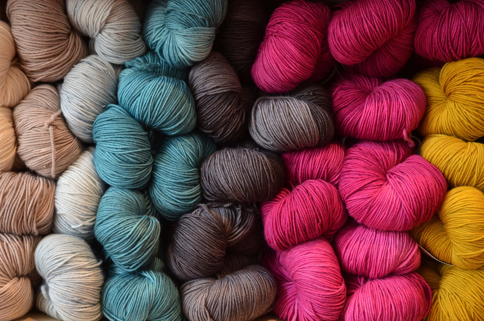 Assorted Multi-colored Knitworks And Varied Knitting Yarns