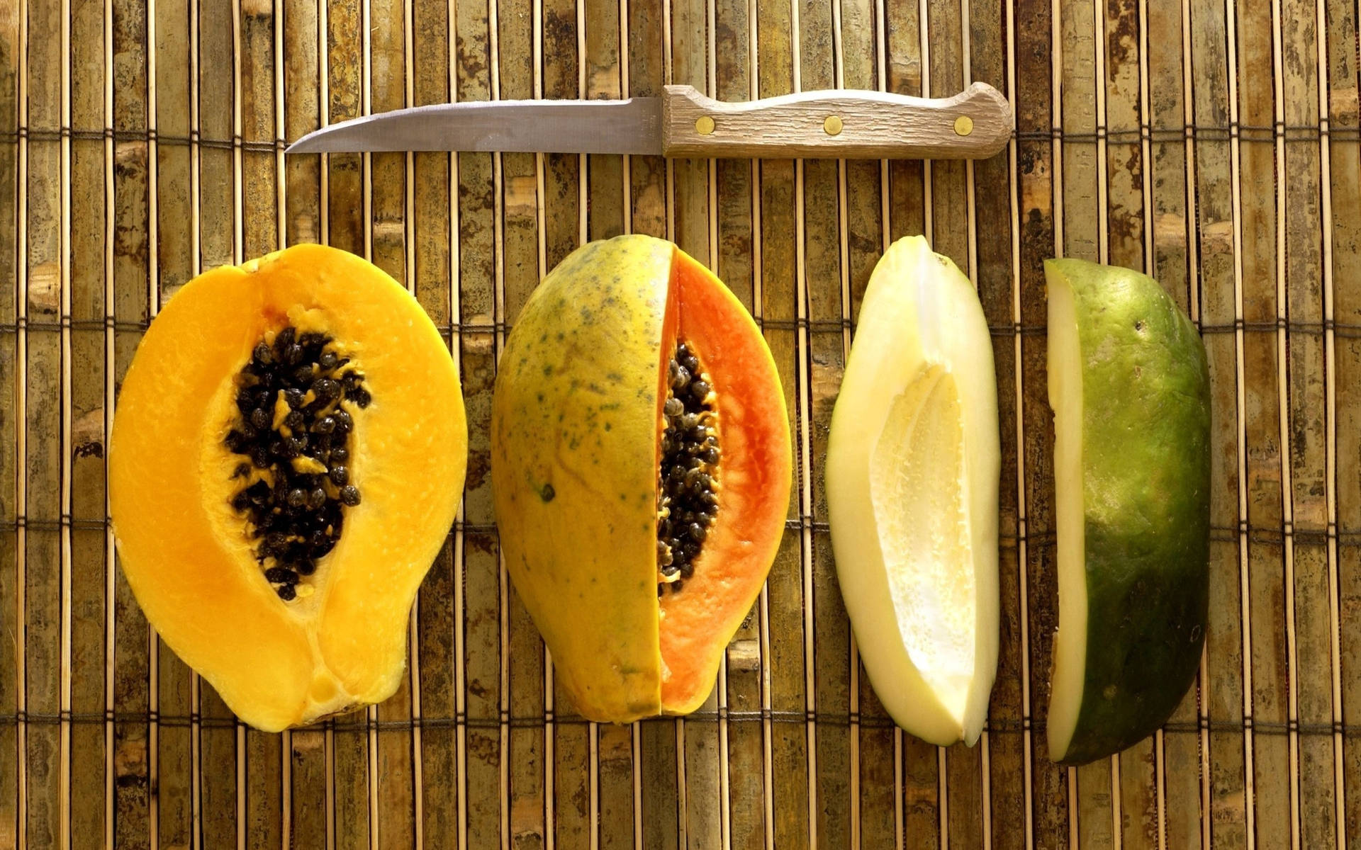 Assorted Ripe And Unripe Papaya Fruits Background