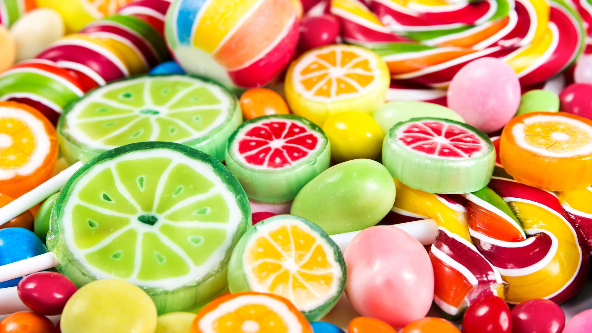 Assorted Sliced Fruits Candies Background