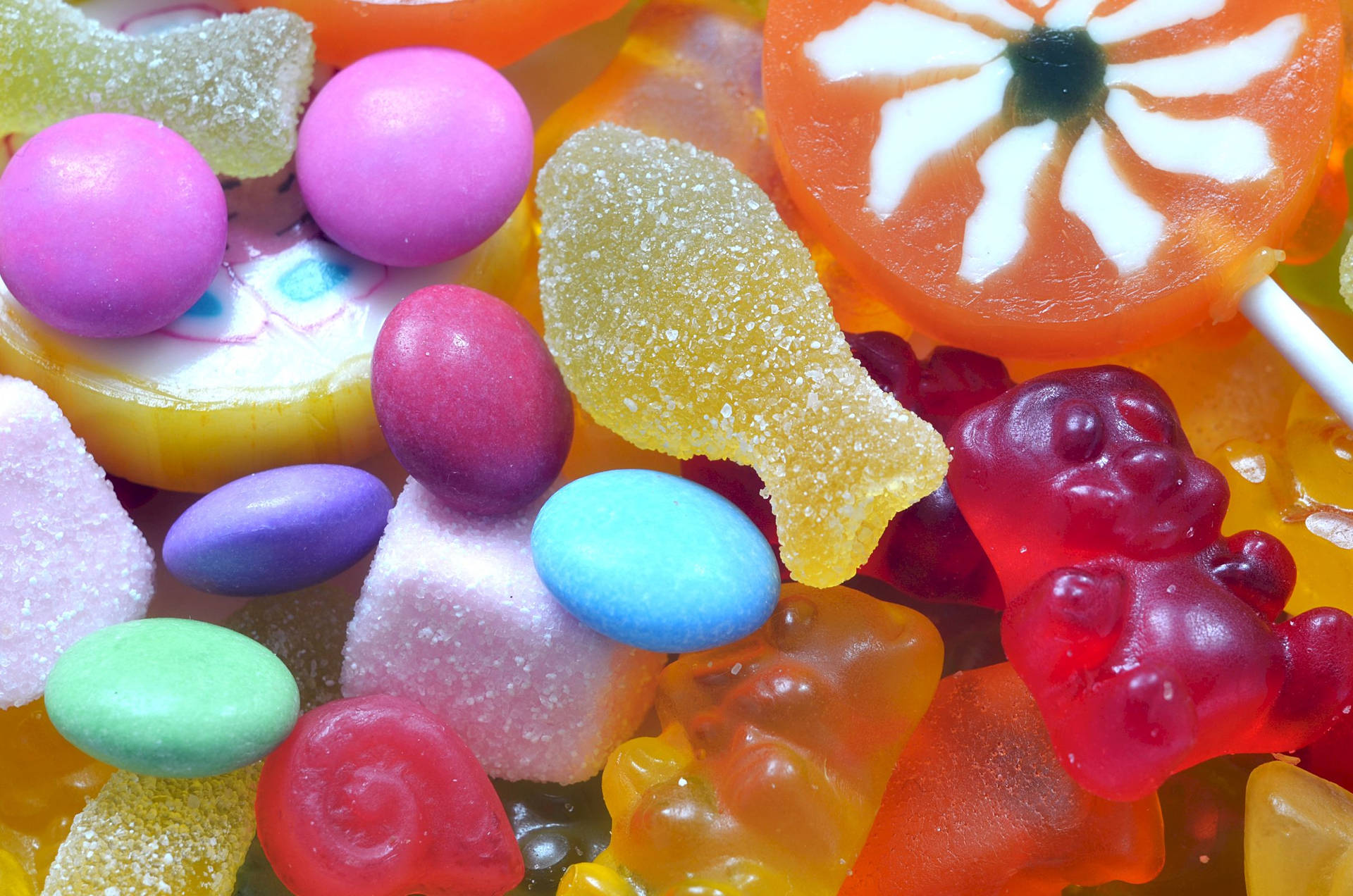 Assortment Of Vibrant Sour Candy Background