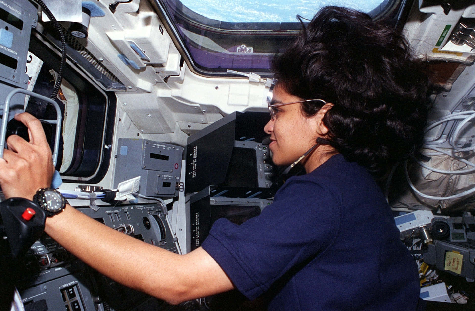 Astronaut_at_ Space_ Shuttle_ Controls Background