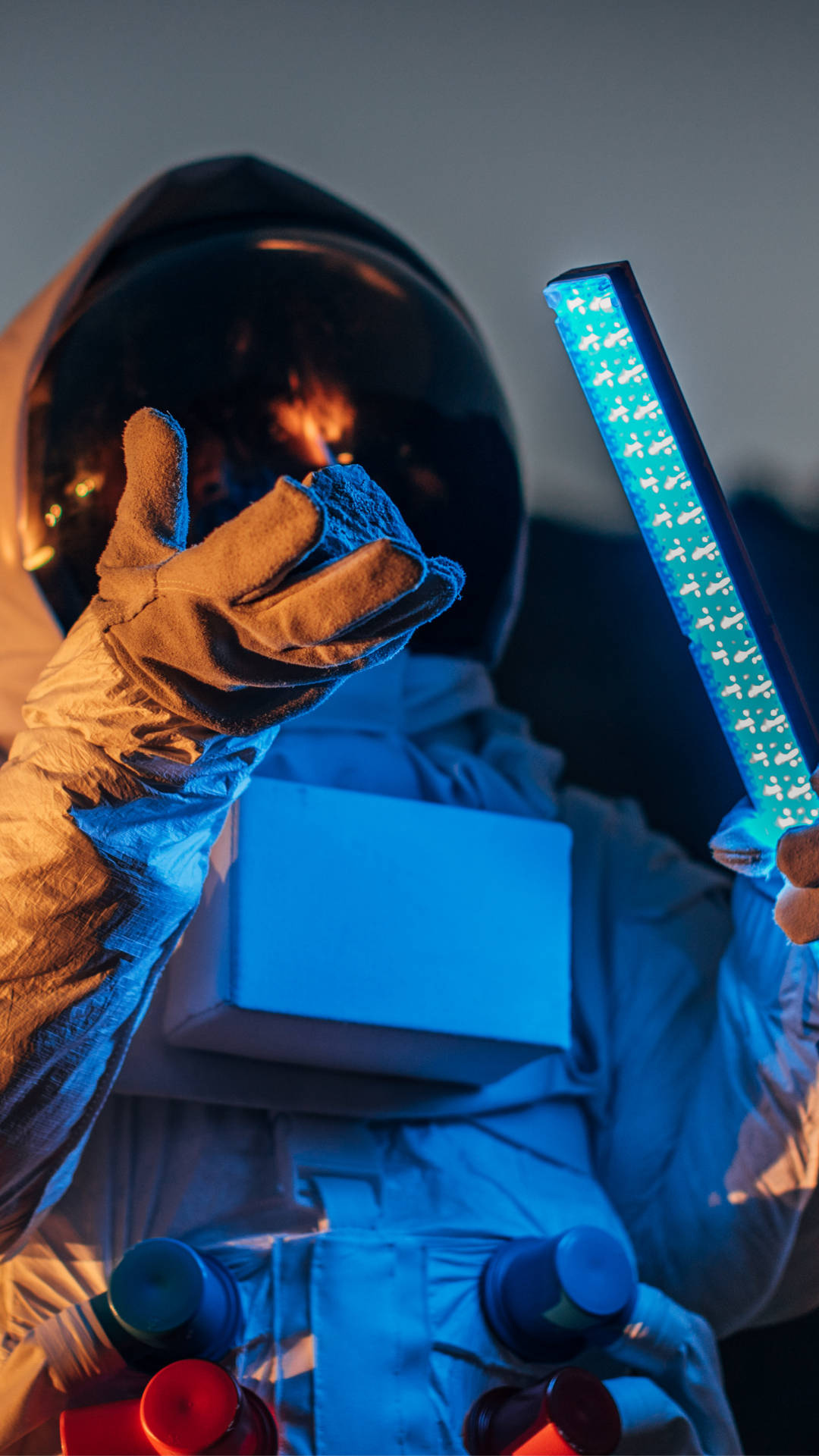 Astronaut Holding Blue Light