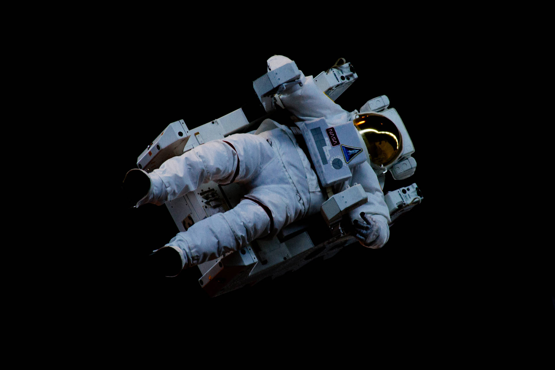 Astronaut In Space Floating While Sitting Background