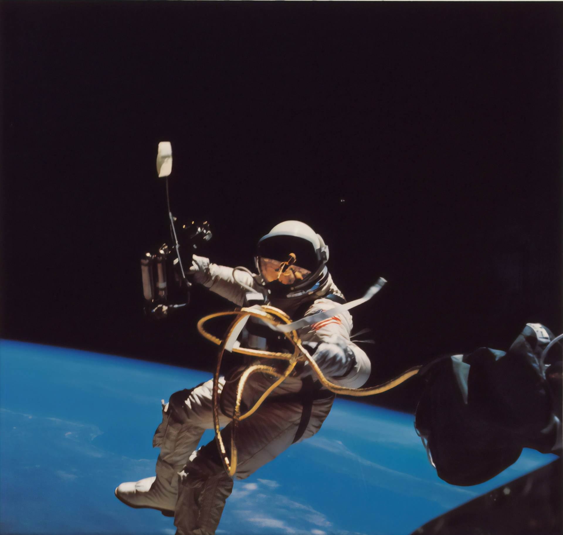Astronaut In Space Holding Space Tools Background