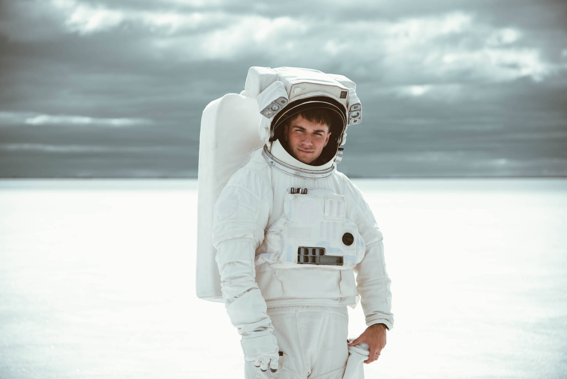 Astronaut In Space Posing In Suit Background