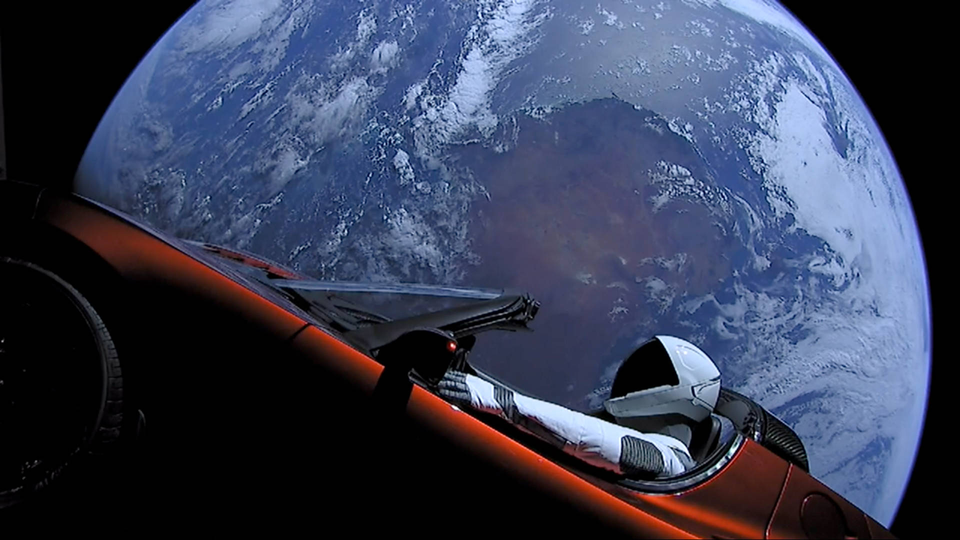 Astronaut In Space Riding A Car Background
