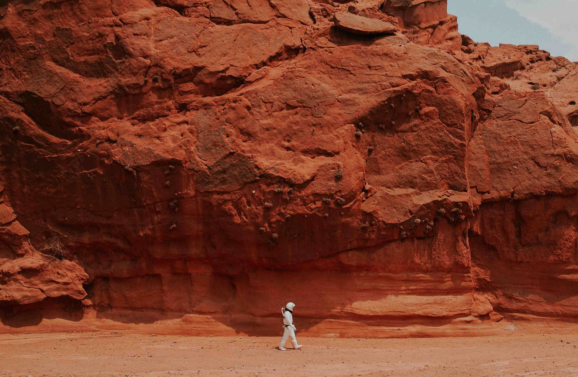 Astronaut In Space Walking On Mars Background