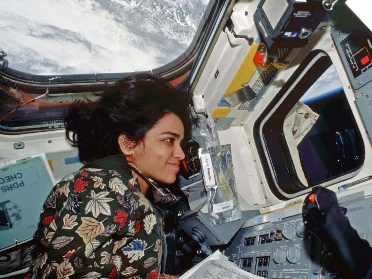 Astronaut Kalpana Chawla Space Shuttle Cockpit Background