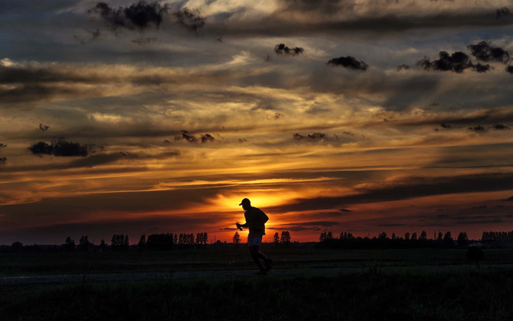 Athlete Silhouette Running During Sunset
