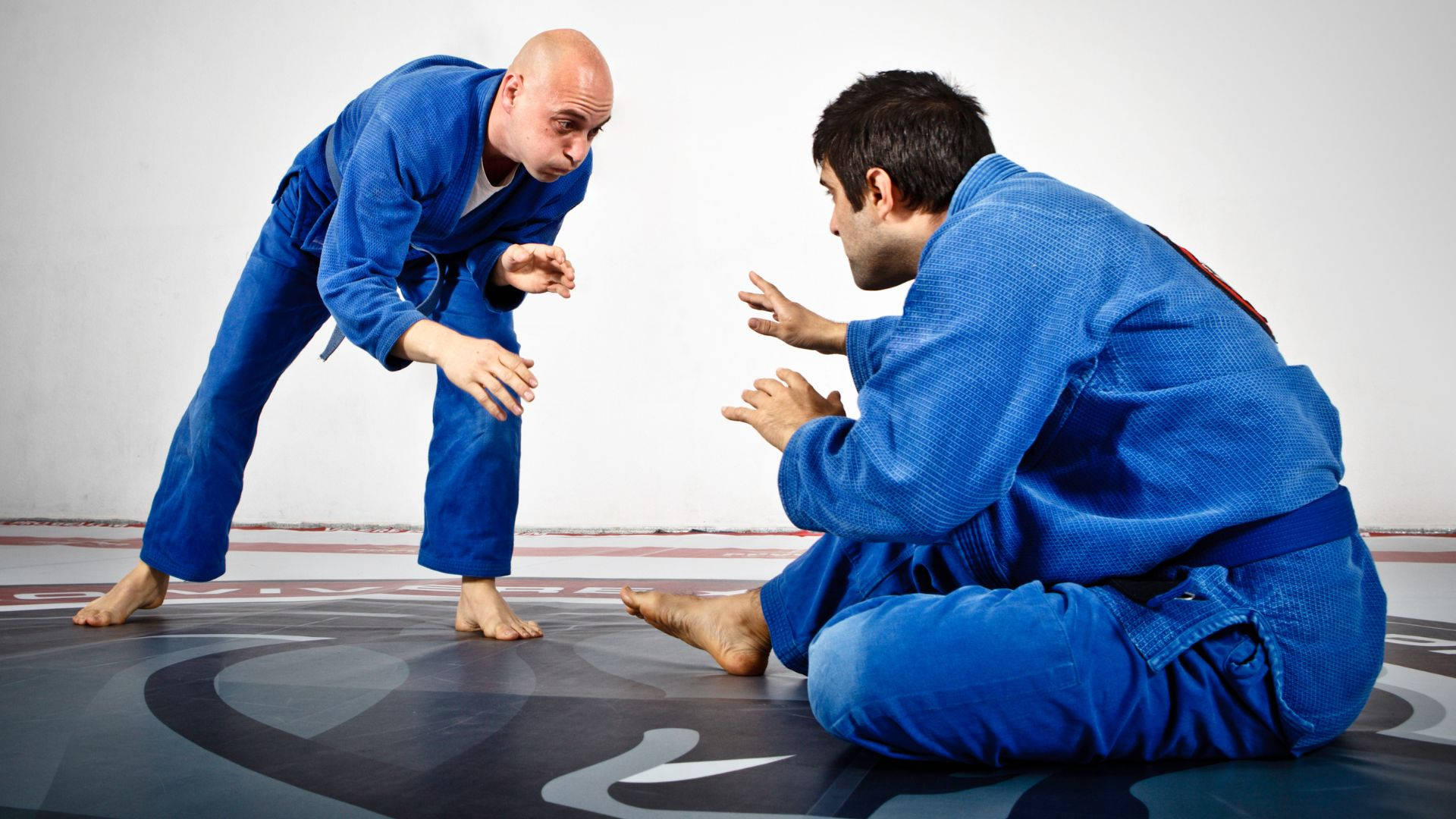 Athletic Brazilian Jiu-jitsu Fighter In Action Background