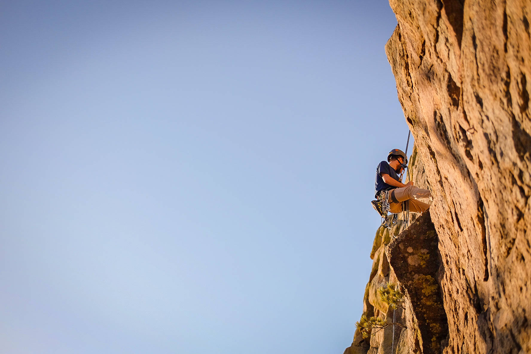 Athletic Endeavor - A Solo Sport Climber Scaling Heights Background