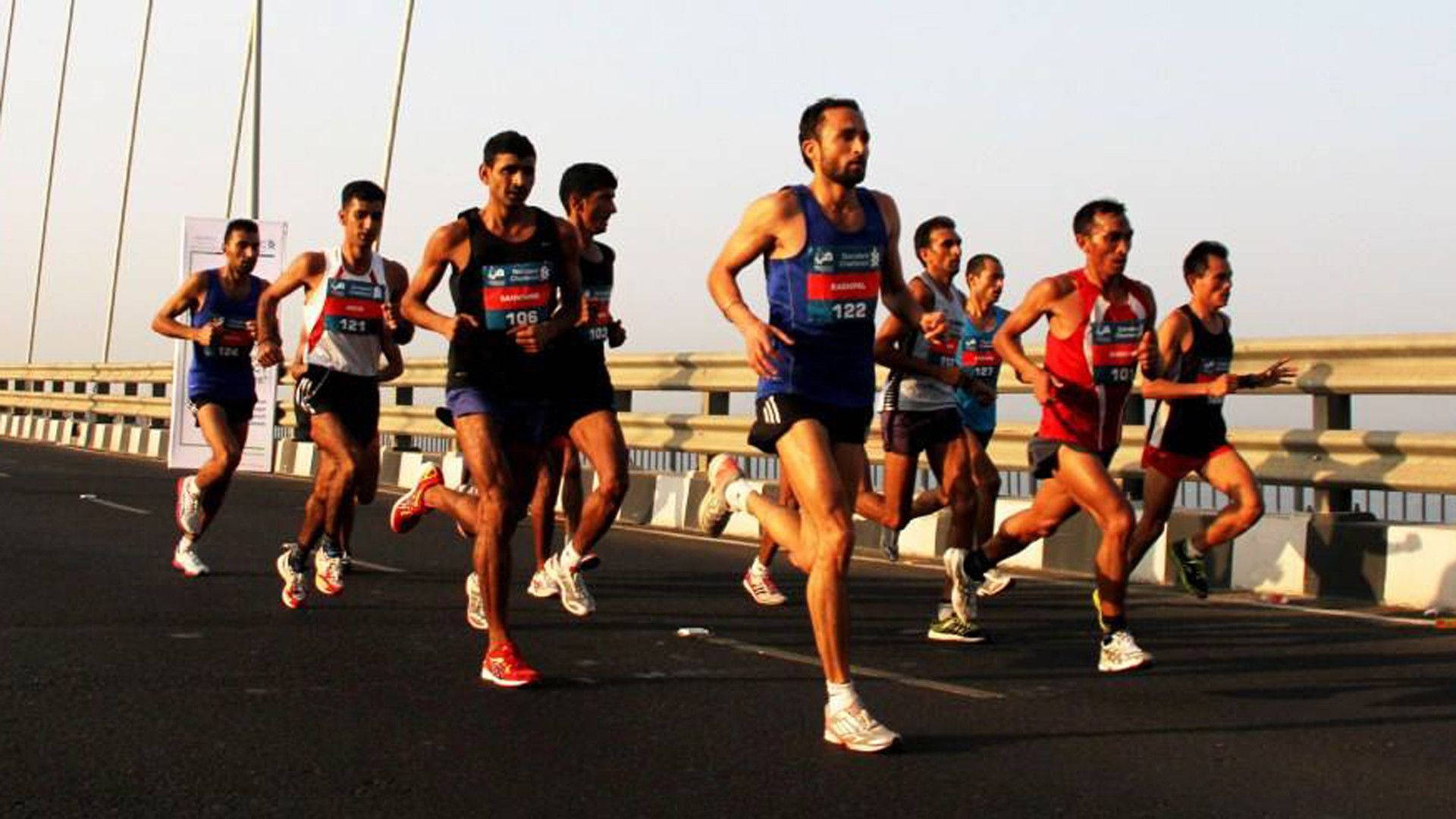 Athletic Men In Marathon Background