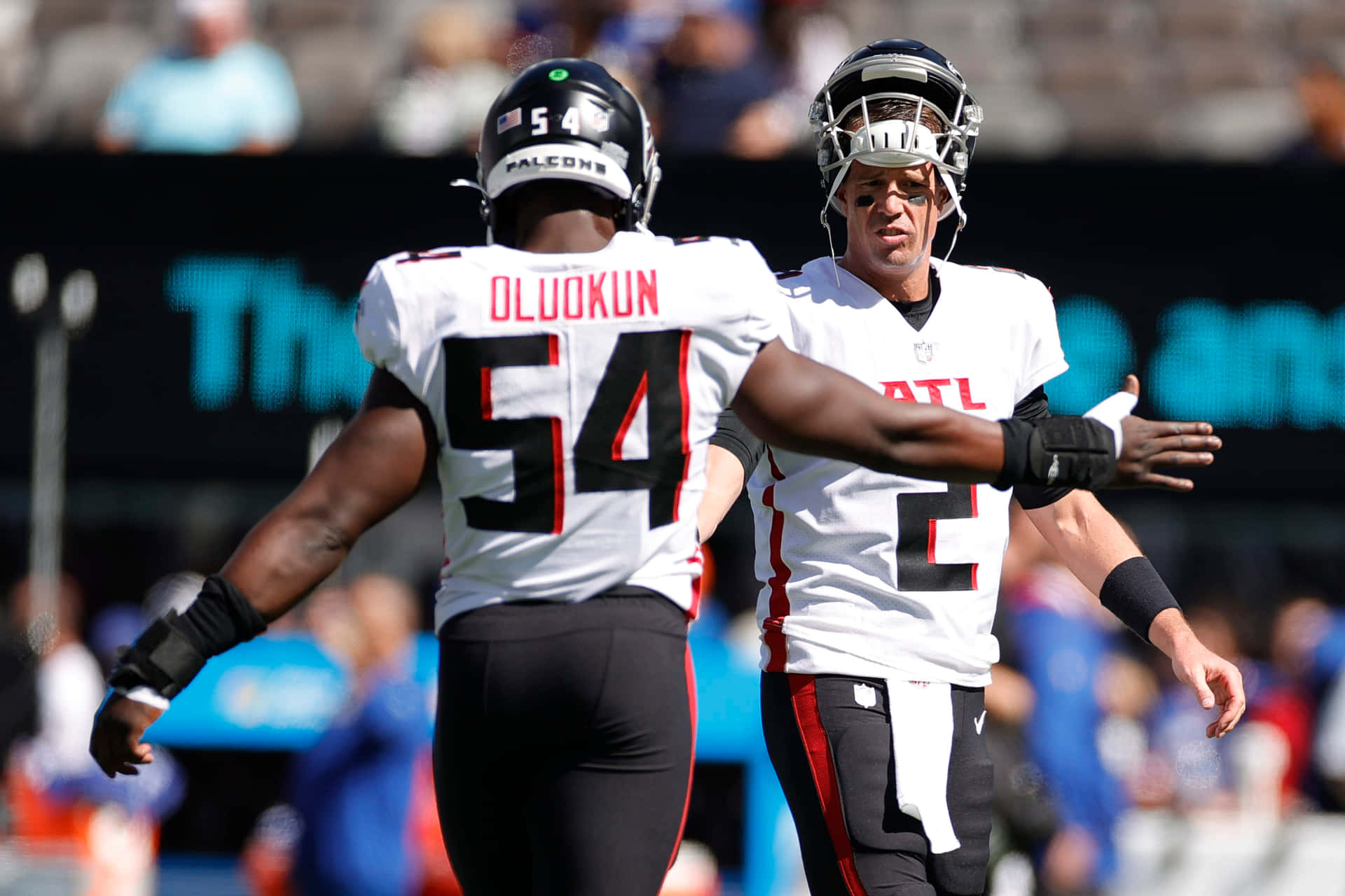 Atlanta Falcons Foyesade Oluokun And Matt Ryan Background