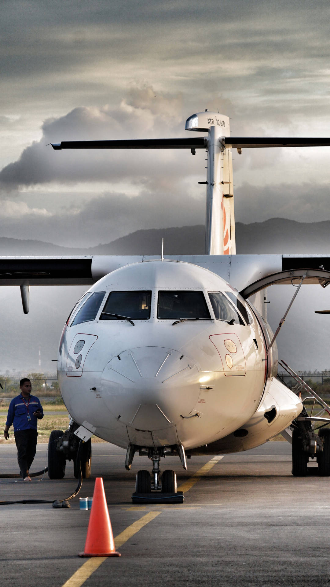 Atr 72 Turboprop Aircraft In Mid-flight Background