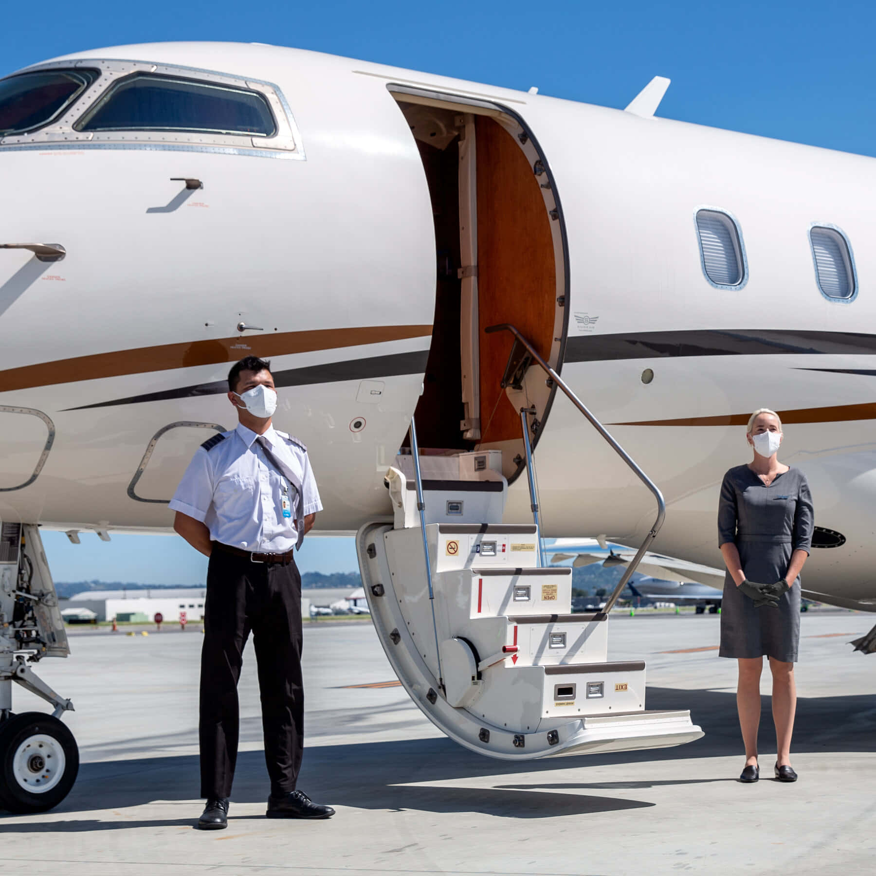 Attendants On Private Jet Background