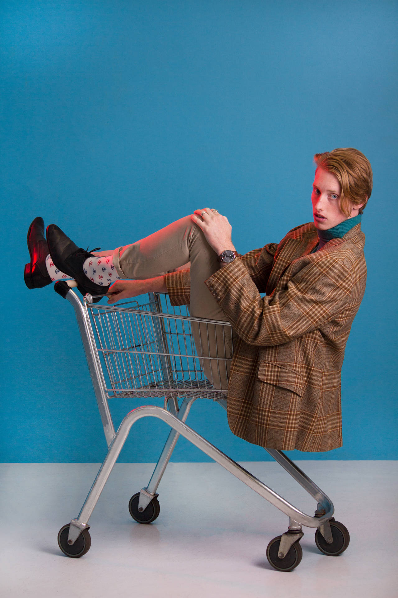 Attitude Boy Riding A Shopping Cart