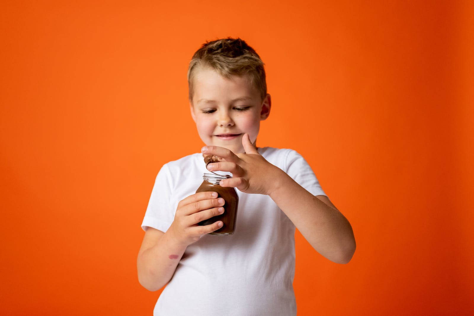 Attitude Boy With Jar Of Chocolate Background